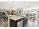 Modern kitchen with large island and stainless steel appliances at 10703 Aldo Moro Dr, Wimauma, FL 33598