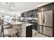 Modern kitchen with stainless steel appliances and granite countertops at 10703 Aldo Moro Dr, Wimauma, FL 33598