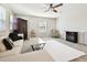 Relaxing living room with fireplace, comfortable seating, and a large rug at 10703 Aldo Moro Dr, Wimauma, FL 33598