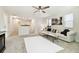 Spacious loft area with plush seating and a large area rug at 10703 Aldo Moro Dr, Wimauma, FL 33598
