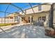 Spacious screened patio with hot tub, perfect for outdoor relaxation at 10703 Aldo Moro Dr, Wimauma, FL 33598