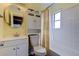 Clean bathroom with toilet, tub, and updated vanity at 1142 56Th N Ave, St Petersburg, FL 33703