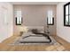 Bright bedroom with a plush bed and wood-paneled accent wall at 13750 Park Blvd # 8, Seminole, FL 33776