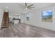 Spacious living room with wood-look floors and large windows at 13750 Park Blvd # 8, Seminole, FL 33776