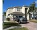 Two-story home with a two-car garage and a paved driveway at 1449 Kaffir Lily Ct, Trinity, FL 34655