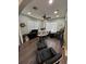 Home office with wood-look floors, ceiling fan, and ample natural light at 1449 Kaffir Lily Ct, Trinity, FL 34655