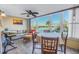 Sunroom with water view, seating area, and round dining table at 1847 Shore S Dr # 414, South Pasadena, FL 33707