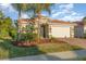 Attractive one-story house featuring a two-car garage and lush landscaping at 19308 Yellowtail Ct, Venice, FL 34292