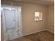 Dining area with view into kitchen and access to entryway at 203 47Th Avenue W Dr # 167, Bradenton, FL 34207