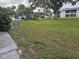 Landscaped lawn area with mature trees at 203 47Th Avenue W Dr # 167, Bradenton, FL 34207