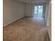 Spacious living room with sliding glass doors to patio at 203 47Th Avenue W Dr # 167, Bradenton, FL 34207