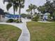 Community pool and patio area with picnic tables at 203 47Th Avenue W Dr # 167, Bradenton, FL 34207