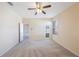 Spacious bedroom with neutral decor, carpet, and private access to backyard at 30237 Lettingwell Cir, Wesley Chapel, FL 33543