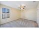 Bedroom featuring neutral walls, carpet, and a ceiling fan at 30237 Lettingwell Cir, Wesley Chapel, FL 33543