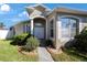 House entrance with double doors and large windows at 30237 Lettingwell Cir, Wesley Chapel, FL 33543