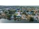 Aerial view showcasing waterfront property and surrounding neighborhood at 3270 Hibiscus Dr, Hernando Beach, FL 34607