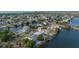 Aerial view of waterfront home with pool and private dock at 3270 Hibiscus Dr, Hernando Beach, FL 34607