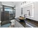 Bathroom with a walk-in shower, vessel sink, and granite countertop at 3270 Hibiscus Dr, Hernando Beach, FL 34607