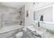 Bathroom with soaking tub, modern vanity, and granite countertop at 3270 Hibiscus Dr, Hernando Beach, FL 34607