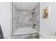 Bathroom with a soaking tub and gray tile shower surround at 3270 Hibiscus Dr, Hernando Beach, FL 34607
