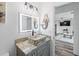 Bathroom with a vessel sink and a view of the living room at 3270 Hibiscus Dr, Hernando Beach, FL 34607