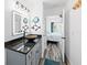 Modern bathroom with a vessel sink, vanity, and view of bedroom at 3270 Hibiscus Dr, Hernando Beach, FL 34607