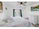 Bright bedroom with a king-size bed and access to a balcony at 3270 Hibiscus Dr, Hernando Beach, FL 34607