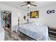 Main bedroom with king-size bed, ceiling fan, and large closet at 3270 Hibiscus Dr, Hernando Beach, FL 34607