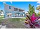 Elevated home with covered parking and a waterfront view at 3270 Hibiscus Dr, Hernando Beach, FL 34607
