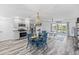 Open concept kitchen and dining area with stainless steel appliances at 3270 Hibiscus Dr, Hernando Beach, FL 34607
