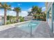 Inviting pool area with spacious patio and a shed at 3270 Hibiscus Dr, Hernando Beach, FL 34607