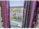 Window view of a canal, palm trees, and a backyard pool at 3270 Hibiscus Dr, Hernando Beach, FL 34607