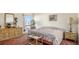 Bright bedroom with a dresser and large bed at 440 S Gulfview Blvd # 905, Clearwater Beach, FL 33767