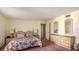 Bedroom with king-size bed and dresser at 440 S Gulfview Blvd # 905, Clearwater Beach, FL 33767