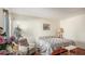 Bedroom with a large bed, chair, and plant at 440 S Gulfview Blvd # 905, Clearwater Beach, FL 33767