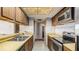 Galley kitchen with stainless steel appliances at 440 S Gulfview Blvd # 905, Clearwater Beach, FL 33767
