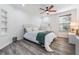 Bright bedroom with a queen bed and built-in shelving at 5203 Green Forest Ct, Tampa, FL 33647