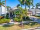 Attractive one-story home with palm trees and a landscaped yard at 5205 Covesound Way, Apollo Beach, FL 33572