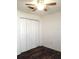 Bright bedroom with wood-look floors and spacious closet at 5338 James St, New Port Richey, FL 34652