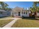 Charming bungalow with a welcoming front porch and landscaped lawn at 5608 N 9Th St, Tampa, FL 33604