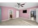 Main bedroom with a ceiling fan, neutral walls, and carpet flooring at 5610 13Th N Ave, St Petersburg, FL 33710