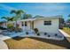 House exterior showcasing a walkway and well-maintained landscaping at 5610 13Th N Ave, St Petersburg, FL 33710