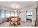 Dining room with wood table and chairs, and view of bedroom at 5970 Hillside St, Seminole, FL 33772