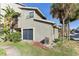 Side view of condo showing balcony, landscaping and AC unit at 6336 Newtown Cir # 36A1, Tampa, FL 33615