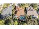 Aerial perspective of three homes with pools and surrounding landscape at 8507 Portage Ave, Tampa, FL 33647