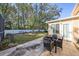 Relaxing backyard patio with seating area and lush landscaping at 8507 Portage Ave, Tampa, FL 33647