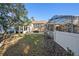 Spacious backyard with grassy area, patio, and pool in the background at 8507 Portage Ave, Tampa, FL 33647