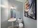 Elegant powder room with pedestal sink and modern fixtures at 8507 Portage Ave, Tampa, FL 33647