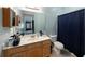 Well-lit bathroom with shower, vanity, and updated fixtures at 8507 Portage Ave, Tampa, FL 33647