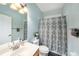 Clean bathroom with shower/tub combo, vanity, and updated fixtures at 8507 Portage Ave, Tampa, FL 33647